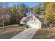 Exterior view of a single-Gathering home with a long driveway at 90 Loudoun Dr, Covington, GA 30014