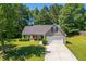 Charming single-Gathering home with a well-manicured lawn and attached two car garage in a wooded neighborhood at 90 Loudoun Dr, Covington, GA 30014