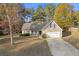 Ranch style home with attached garage and landscaped yard at 90 Loudoun Dr, Covington, GA 30014