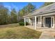 House exterior with front porch and stone accents at 90 Loudoun Dr, Covington, GA 30014