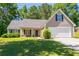 Charming single-Gathering home with a well-manicured lawn, covered porch, and attached two car garage at 90 Loudoun Dr, Covington, GA 30014