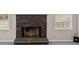 Stone fireplace with a hearth in a living room at 90 Loudoun Dr, Covington, GA 30014