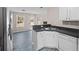 Modern kitchen with white cabinets and dark countertops at 90 Loudoun Dr, Covington, GA 30014