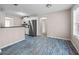 Eat-in kitchen features stainless steel appliances, white cabinetry, and durable vinyl plank flooring at 90 Loudoun Dr, Covington, GA 30014