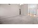Spacious living room with vaulted ceiling and neutral carpeting throughout at 90 Loudoun Dr, Covington, GA 30014