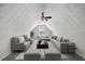 Spacious living room featuring a vaulted ceiling, ceiling fan, and comfortable seating arrangement at 90 Loudoun Dr, Covington, GA 30014