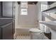 Bright bathroom featuring a tub, toilet, and sink, enhanced by subway tile and decorative flooring at 908 Juniper Ne St # 205, Atlanta, GA 30309