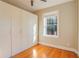 Bedroom featuring a custom built-in wardrobe for generous storage and a sunlit window at 908 Juniper Ne St # 205, Atlanta, GA 30309