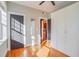 Bedroom featuring a doorway, closet, and beautiful hardwood floors with natural light at 908 Juniper Ne St # 205, Atlanta, GA 30309