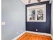 Serene bedroom featuring soft blue walls, hardwood floors, and natural light from a window at 908 Juniper Ne St # 205, Atlanta, GA 30309