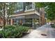 Building exterior featuring a Starbucks coffee shop on the ground floor with outdoor seating at 908 Juniper Ne St # 205, Atlanta, GA 30309
