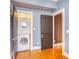 Convenient in-unit laundry room with stacked washer and dryer for efficient space-saving at 908 Juniper Ne St # 205, Atlanta, GA 30309