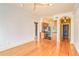 Open-concept living area with hardwood floors flowing into a modern kitchen with stainless steel appliances at 908 Juniper Ne St # 205, Atlanta, GA 30309