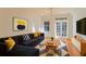 Bright living room with a comfortable sofa and ample natural light at 908 Juniper Ne St # 205, Atlanta, GA 30309