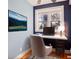 Well-lit home office with calming decor, a sleek desk, and a picturesque view from the window at 908 Juniper Ne St # 205, Atlanta, GA 30309