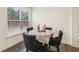 Small breakfast nook with four black chairs and a round table at 7621 Avalon Blvd, Fairburn, GA 30213