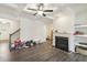 Open living room featuring hardwood floors and a fireplace at 7621 Avalon Blvd, Fairburn, GA 30213