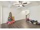 Bright living room with hardwood floors and a Christmas tree at 7621 Avalon Blvd, Fairburn, GA 30213