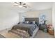 Large main bedroom with tufted headboard and ceiling fan at 7621 Avalon Blvd, Fairburn, GA 30213