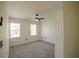 Bright bedroom featuring neutral paint, carpet, ceiling fan and natural light at 1420 Midland Way, Lawrenceville, GA 30043