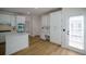 Bright kitchen featuring white cabinets, stainless steel appliances, a center island and modern fixtures at 1420 Midland Way, Lawrenceville, GA 30043