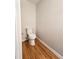 Small bathroom with toilet and hardwood floors at 5005 Dublin Dr, South Fulton, GA 30331