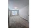 Carpeted bedroom with window and neutral walls at 5005 Dublin Dr, South Fulton, GA 30331