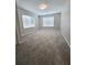 Well-lit bedroom featuring large window and carpet at 5005 Dublin Dr, South Fulton, GA 30331