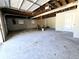 Unfinished two-car garage with open ceiling at 5005 Dublin Dr, South Fulton, GA 30331