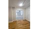 Hardwood floor hallway with door to large bedroom at 5005 Dublin Dr, South Fulton, GA 30331