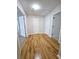 Hardwood floor hallway with multiple doors and closets at 5005 Dublin Dr, South Fulton, GA 30331