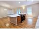 Open kitchen with island, hardwood floors, and lots of natural light at 5005 Dublin Dr, South Fulton, GA 30331