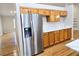 Kitchen boasts stainless steel refrigerator and wood cabinetry at 5005 Dublin Dr, South Fulton, GA 30331