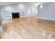 Living room showcasing hardwood floors and a central fireplace at 5005 Dublin Dr, South Fulton, GA 30331