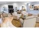Spacious living room with hardwood floors, fireplace, and ample natural light at 5005 Dublin Dr, South Fulton, GA 30331