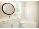 Bathroom with white vanity, large mirror, and tiled shower/tub combo at 1150 Sweet Mia Ln, Powder Springs, GA 30127