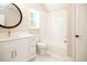 Bright bathroom with white vanity, bathtub, and marble-look floors at 1150 Sweet Mia Ln, Powder Springs, GA 30127