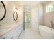 Spa-like bathroom with a soaking tub and separate shower at 1150 Sweet Mia Ln, Powder Springs, GA 30127