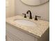 Bathroom vanity with granite countertop and bronze faucet at 1150 Sweet Mia Ln, Powder Springs, GA 30127