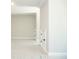 Spacious bedroom with neutral walls and carpet flooring, including built-in storage at 1150 Sweet Mia Ln, Powder Springs, GA 30127