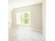 Spacious bedroom with a large window and new carpet at 1150 Sweet Mia Ln, Powder Springs, GA 30127