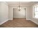 Bright dining room with hardwood floors and a modern chandelier at 1150 Sweet Mia Ln, Powder Springs, GA 30127