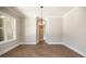 Formal dining room features hardwood floors and a modern chandelier at 1150 Sweet Mia Ln, Powder Springs, GA 30127