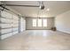 Spacious two-car garage with overhead door and windows at 1150 Sweet Mia Ln, Powder Springs, GA 30127