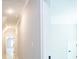 Bright hallway with light walls and tile flooring at 1150 Sweet Mia Ln, Powder Springs, GA 30127