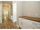 Hallway with wood flooring and built-in storage at 1150 Sweet Mia Ln, Powder Springs, GA 30127
