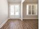 Bright entryway with white double doors and wood-look flooring at 1150 Sweet Mia Ln, Powder Springs, GA 30127