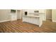 Spacious kitchen with white cabinets, island, and hardwood floors at 1150 Sweet Mia Ln, Powder Springs, GA 30127