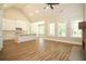 Open concept kitchen with island and white cabinetry at 1150 Sweet Mia Ln, Powder Springs, GA 30127