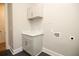 Laundry room with white cabinets and a marble countertop at 1150 Sweet Mia Ln, Powder Springs, GA 30127